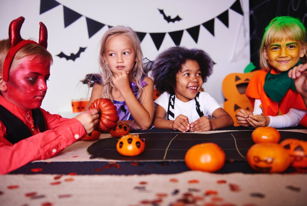 Children playing in costume at halloween party